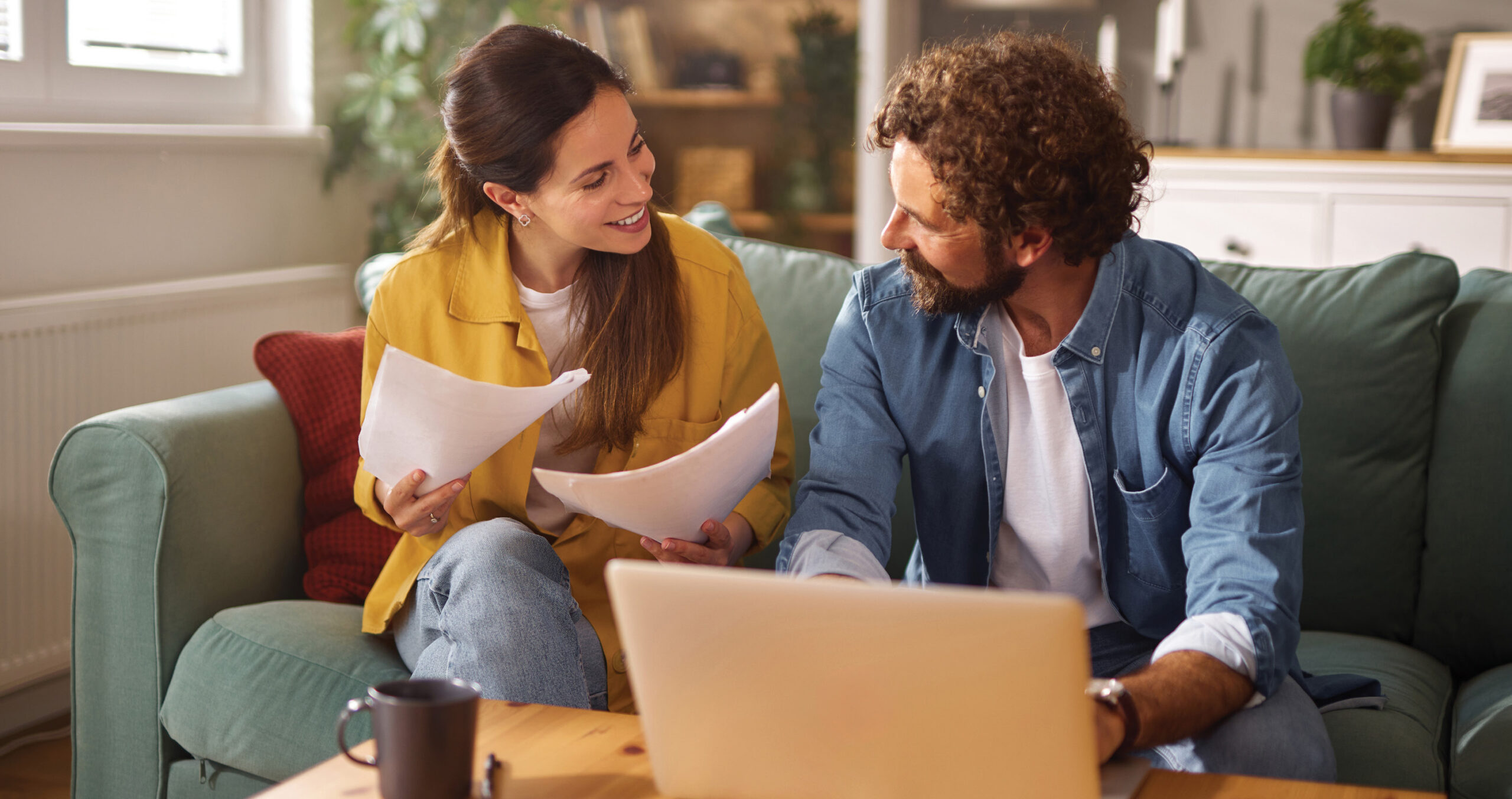 Couple preparing to refinance their home mortgage.