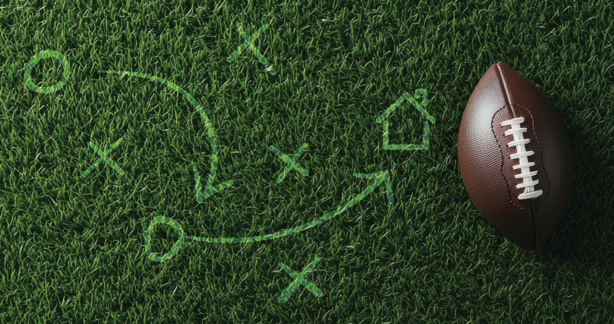 American football strategy overlaying grass next to football