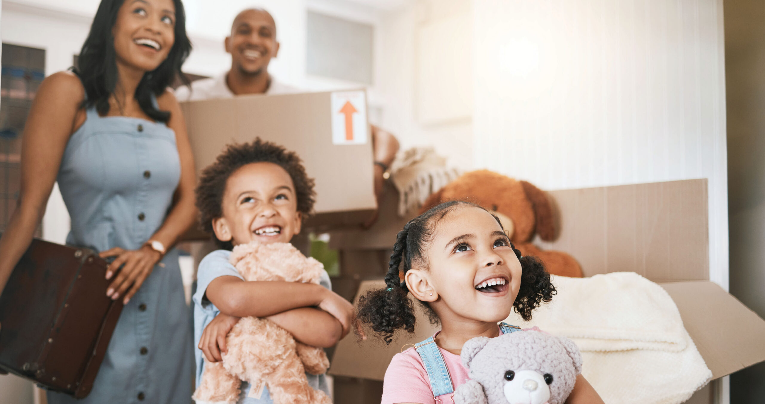 Happy family moving into their new home that was financed with a conventional loan