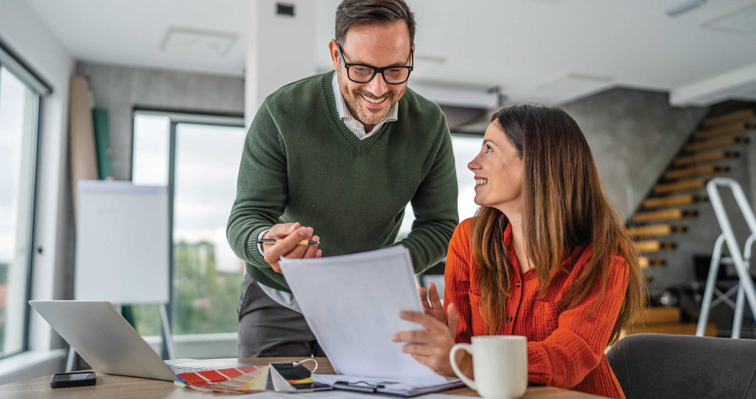couple reviewing the difference between mortgage insurance and homeowners insurance